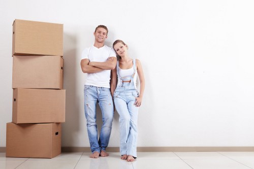 Man and van removals team handling boxes and furniture in Upminster Bridge