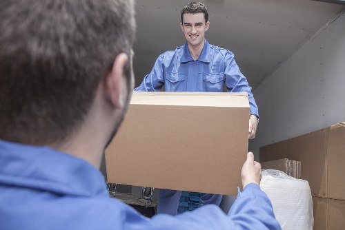 Packed boxes and furniture ready for transport by movers in Upminster Bridge