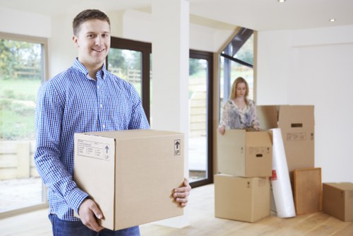 Professional team packing office equipment for a local business move