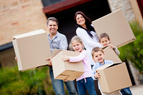 Careful wrapping and sorting of household items during packing services